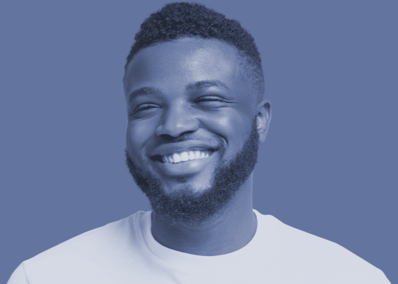 Blue-tinted image of an actor portrayal of Trudhesa™ patient smiling with short hair, looking to the left