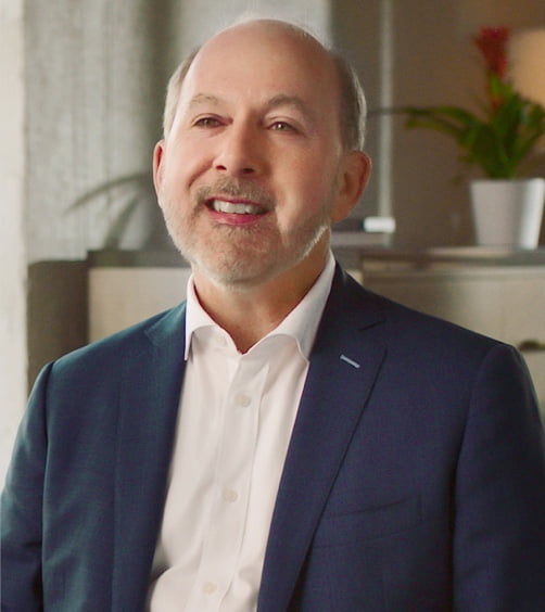 Watch video. Still of Peter McAllister, MD, FAAN, speaking on choosing most appropriate acute treatment for migraine